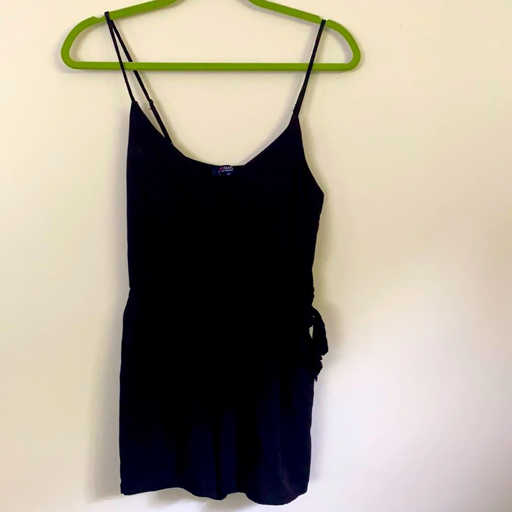 Black romper. Wore once. With bow and pockets.